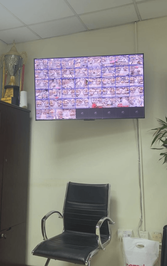 CCTV monitoring wall with multi-camera grid display for warehouse security in Kuwait